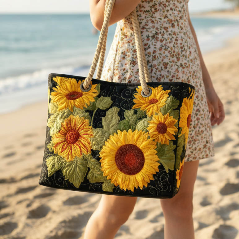 Quilted beach bag with the Sunflower design, open sunflowers in deep gold and butter yellow with dark seeded centres and green leaves
