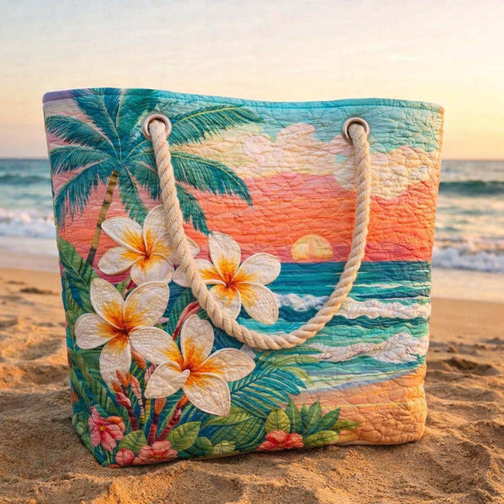 Tropical Spirit quilted beach bag on the sand with a towel and sun cream