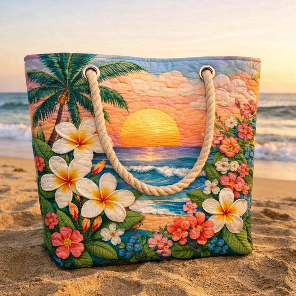 Quilted beach bag with the Tropical Breeze design, large coral and yellow tropical flowers and green leaves across the front