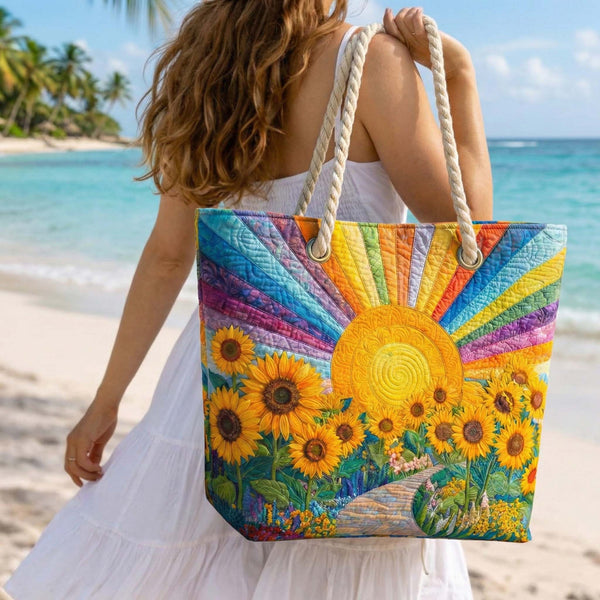 Quilted beach bag with the Rainbow Sun design, a large round sun with rays in bands of coral, marigold, turquoise and green, standing upright
