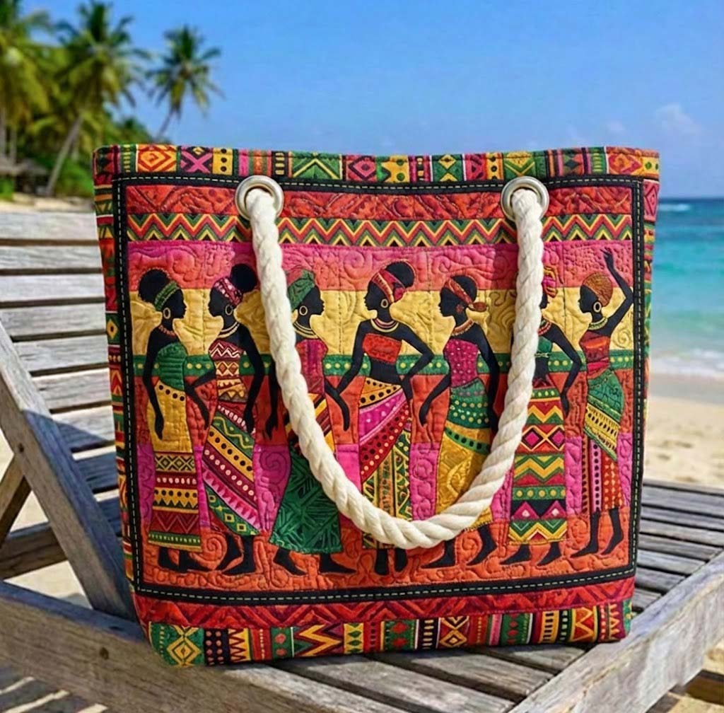 Woman carrying the African Queens quilted beach bag along the shore