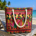 Woman carrying the African Queens quilted beach bag along the shore