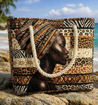 Quilted beach bag with the Radiant Queen design, a portrait of a Black woman in an African print headwrap, standing upright