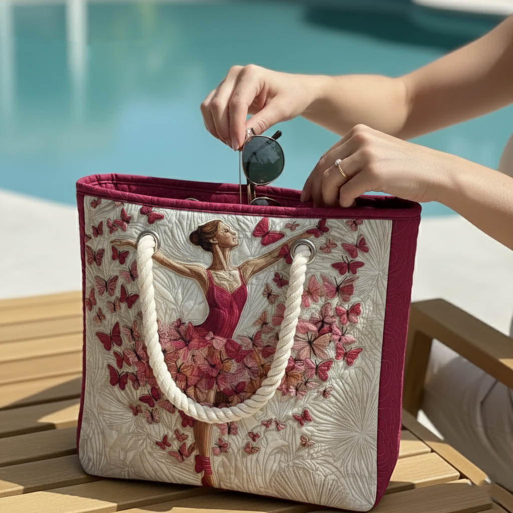 Ballerina and Butterflies quilted beach bag on the sand with a towel and sun cream
