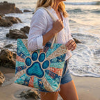 Woman carrying the Paw Print quilted beach bag along the shore