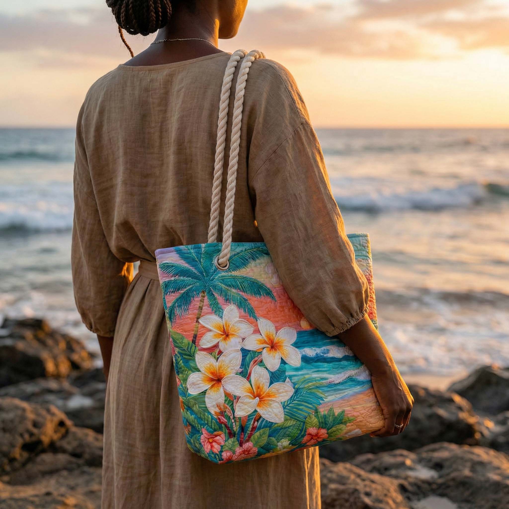 Woman carrying the Tropical Spirit quilted beach bag along the shore