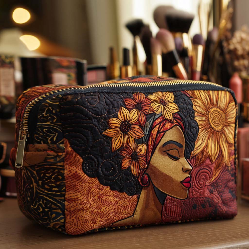 Golden Crown quilted make-up bag with portrait of a woman in a golden head wrap framed by flowers