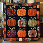 Halloween Pumpkins quilted throw – colourful pumpkins in black squares