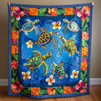 Turtles and Hibiscus quilted throw – sea turtles framed by hibiscus flowers