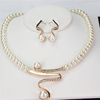 Pearl necklace with a crystal swirl and matching earrings