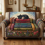 Black Cat Book Nook quilted sofa cover with a black cat asleep on a stack of old books beside a teacup, with a wildflower border