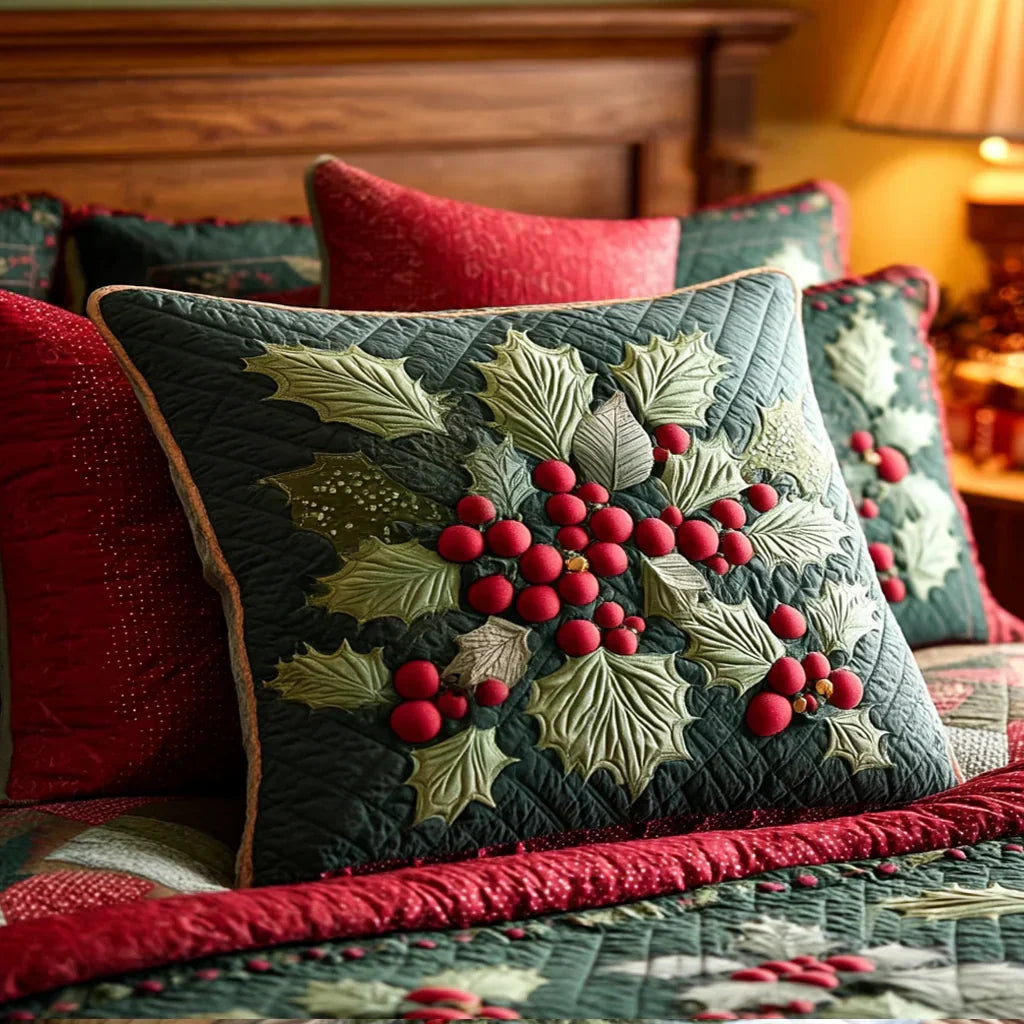 Quilted pillowcase with the Holly Berries design, deep green holly leaves and bright red berries winding across the wave-stitch quilted front