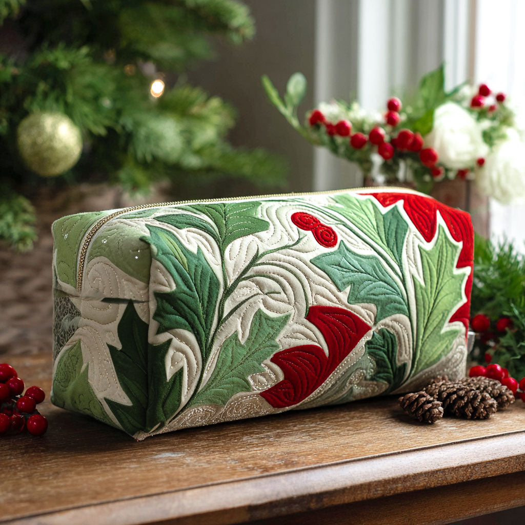 Holly Bloom quilted make-up bag with red and green holly leaves swirling across white quilting