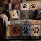 Home Paws quilted sofa cover with large tan, stone grey, walnut, cream and burgundy squares each carrying a soft-edged paw print
