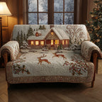 Reindeer Cottage quilted sofa cover – reindeer before a glowing cottage