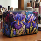 Iris Charm quilted make-up bag with purple and blue irises in a stained-glass style
