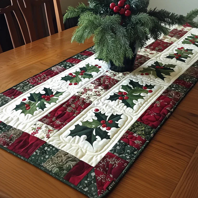 Quilted table runner with a Jingle Bells design of gold and silver bells hanging from holly sprigs and ribbon on deep Christmas red