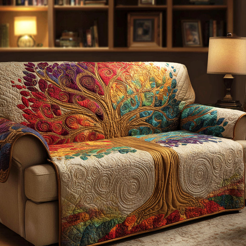 Blossom Tree Dawn quilted sofa cover – colourful tree above cream swirls