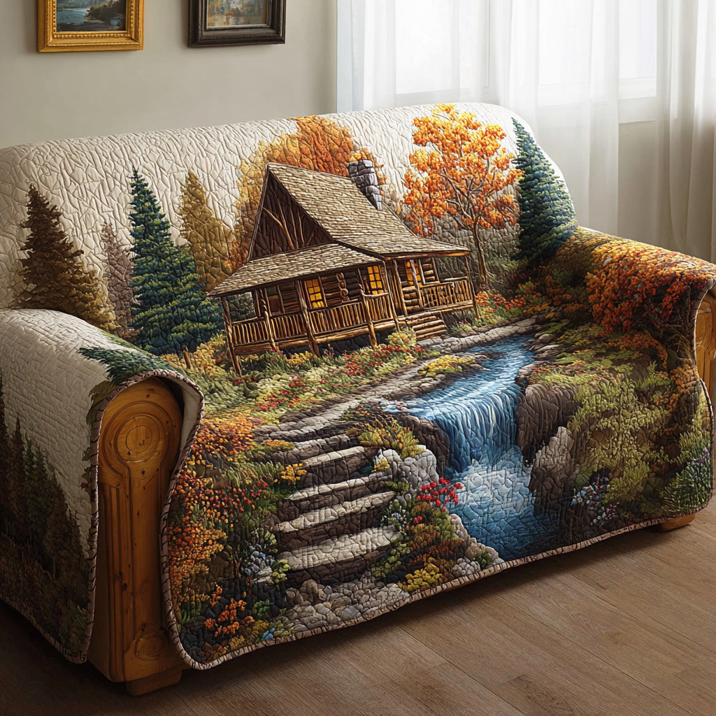 Autumn Cabin Falls quilted sofa cover – cabin by a waterfall in autumn