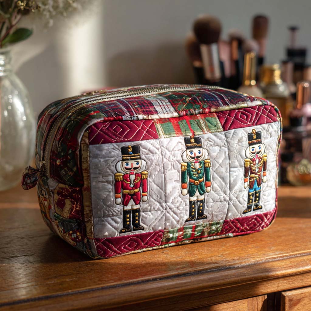 Quilted make-up bag with a row of grinning nutcrackers in red, blue and gold standing between candy canes, striped bunting and pine sprigs in the Merry Nutcracker design