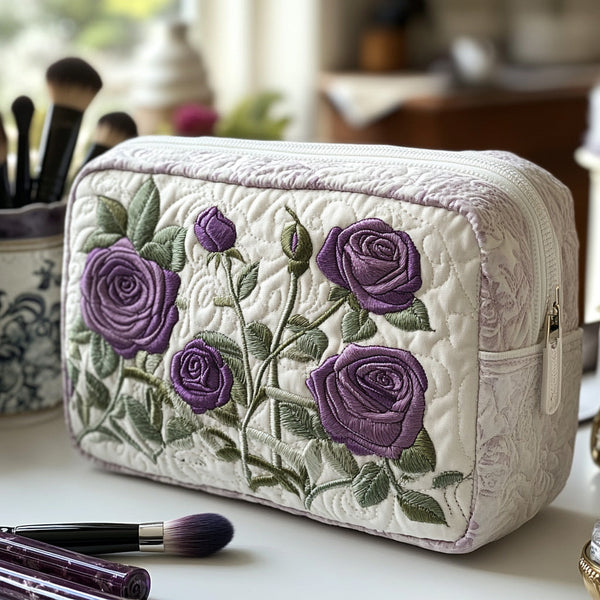 Quilted make-up bag with pale violet roses lit by cool silver light against a deep dusk-blue ground in the Moonlit Bloom design