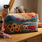 Quilted make-up bag with a retro camper van rolling through open countryside past large daisies and rolling fields under a soft seventies sky in the Nature Dream Ride design