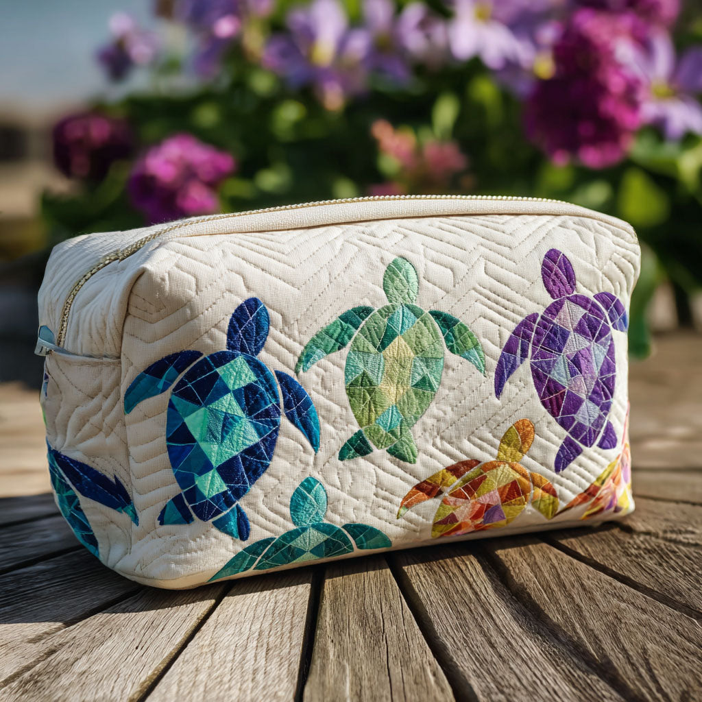 Ocean Drift quilted make-up bag with patchwork sea turtles in teal, green and purple on white