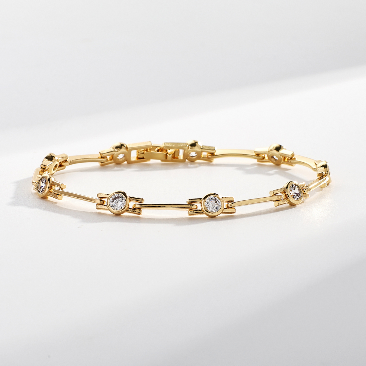 Slim gold-tone bracelet with crystal stations
