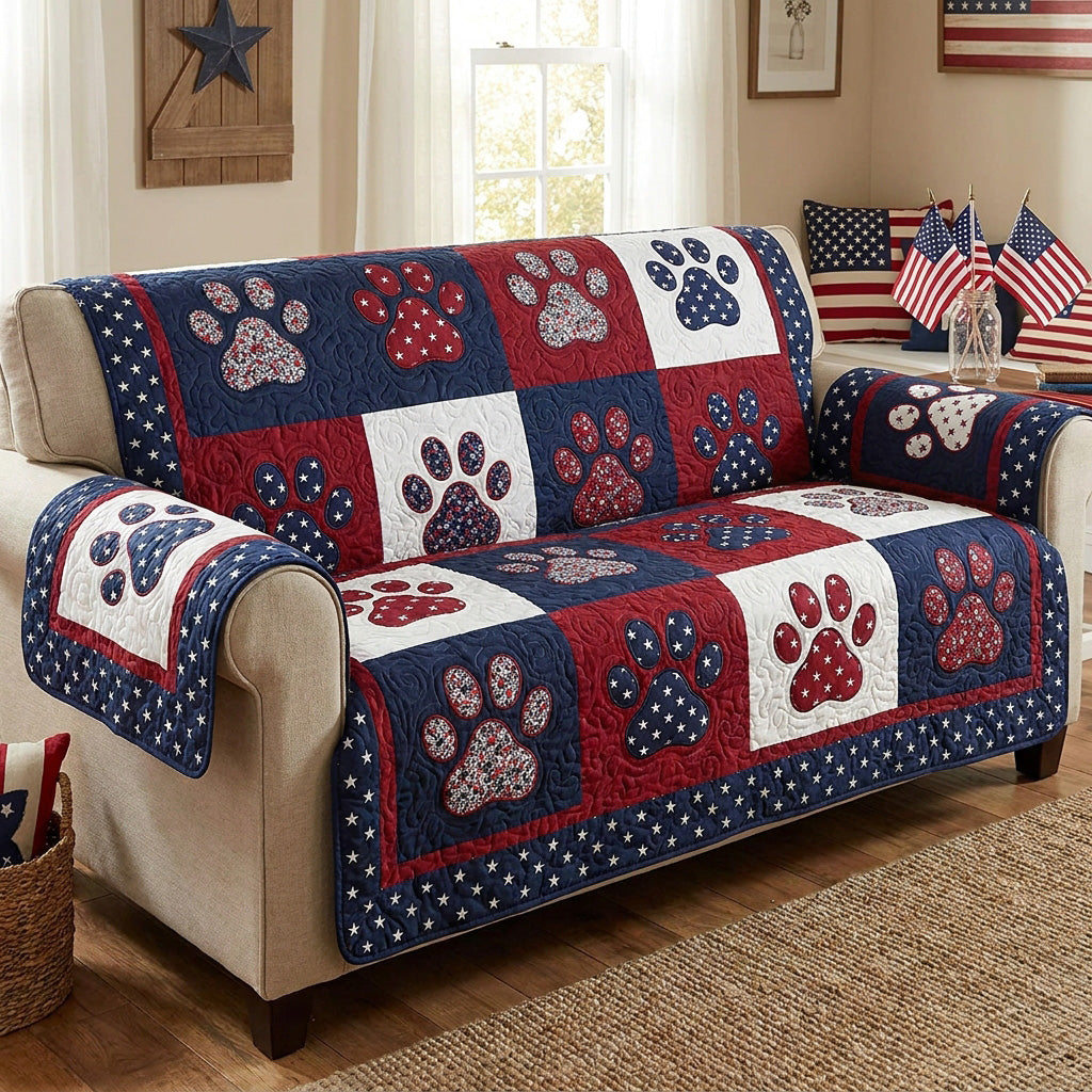 Stars and Paws quilted sofa cover with navy, red and cream blocks carrying paw prints and star-scattered panels