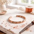 Copper cuff bracelet shaped like segments of bamboo