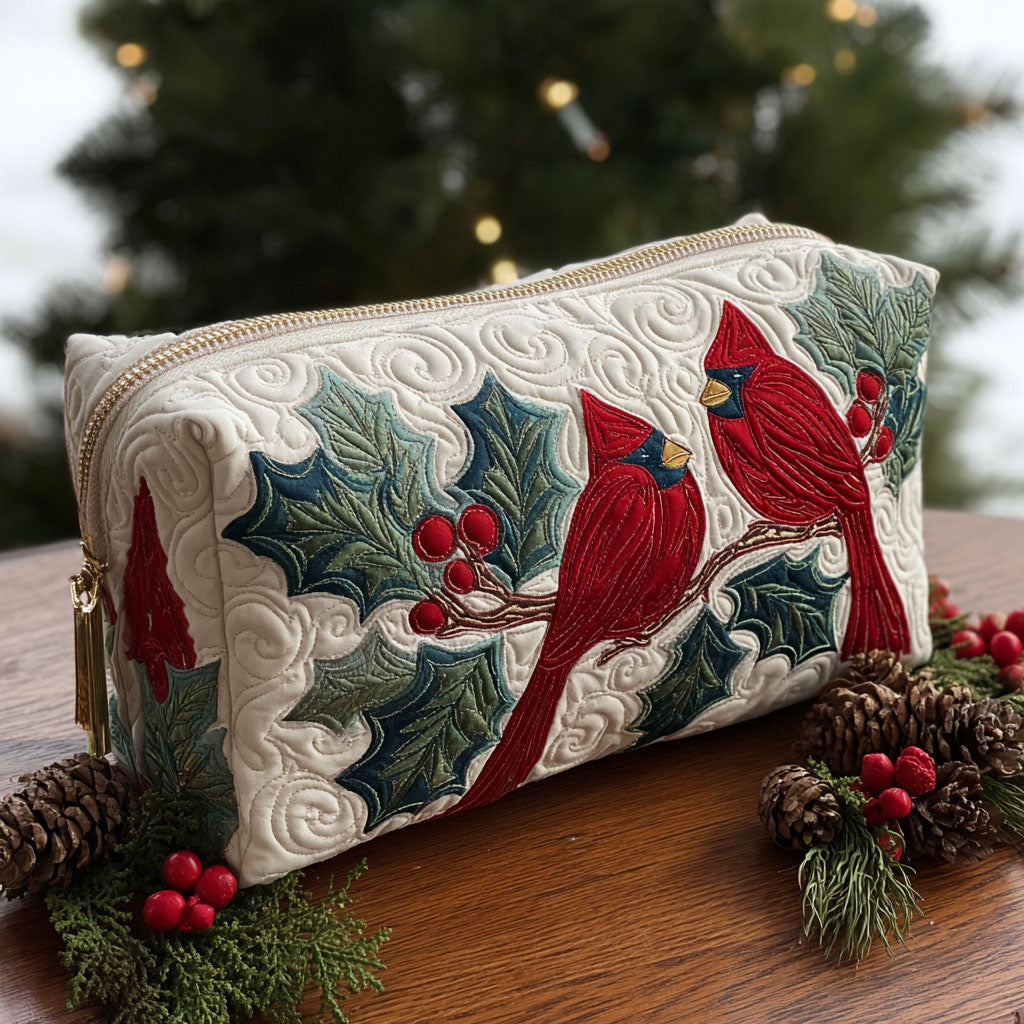 Quilted make-up bag with the Red Feather design of a red cardinal among holly leaves, berries and poinsettia on a deep winter ground