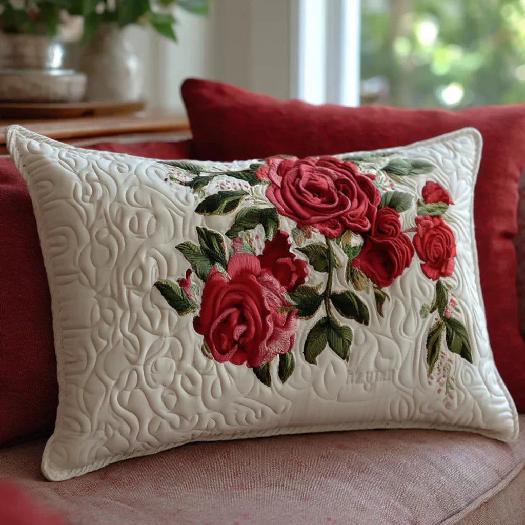 Quilted pillowcase with the Rose Garden Hearts design, garden roses gathered into a soft heart shape in blush, deep pink and leaf green