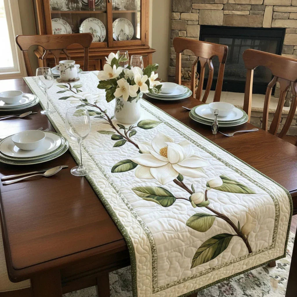 The Rustic Magnolia quilted table runner laid down the centre of a farmhouse dining table