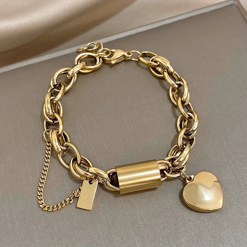 Gold-tone chunky chain bracelet with a heart charm