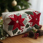 Scarlet Bloom quilted make-up bag with large red poinsettias with green leaves and berries on ivory