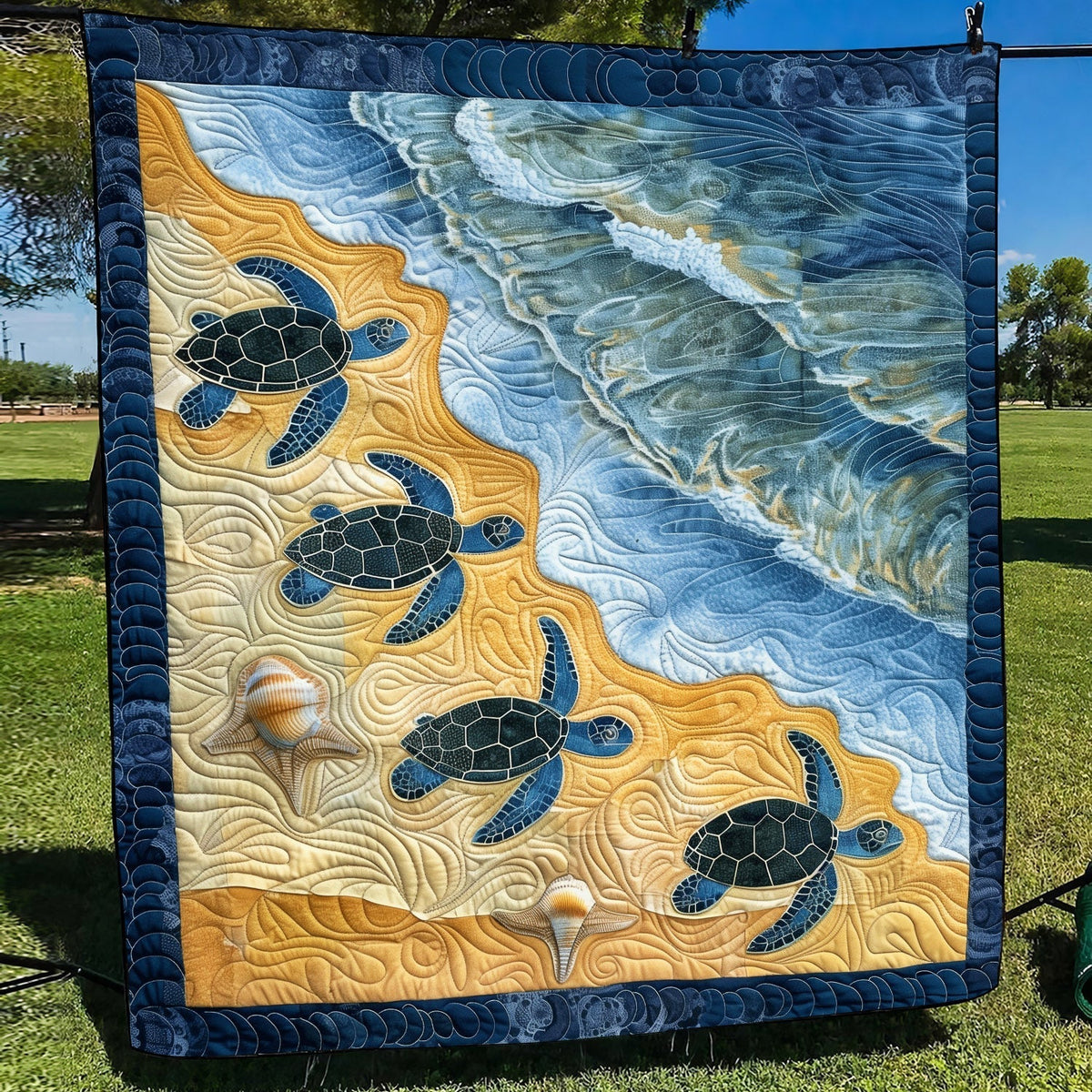 Turtles to the Sea quilted throw – sea turtles crossing golden sand into waves