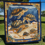 Turtle Family quilted throw – family of sea turtles on a sandy shore