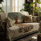 Seasons of Life quilted sofa cover with a full green tree above and copper roots below on soft cream with a tapestry border