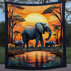 Elephants at Sunset quilted throw – elephant family by a waterhole at sunset