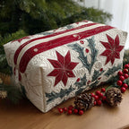 Star Petal quilted make-up bag with red poinsettia stars and green sprigs between red stripes