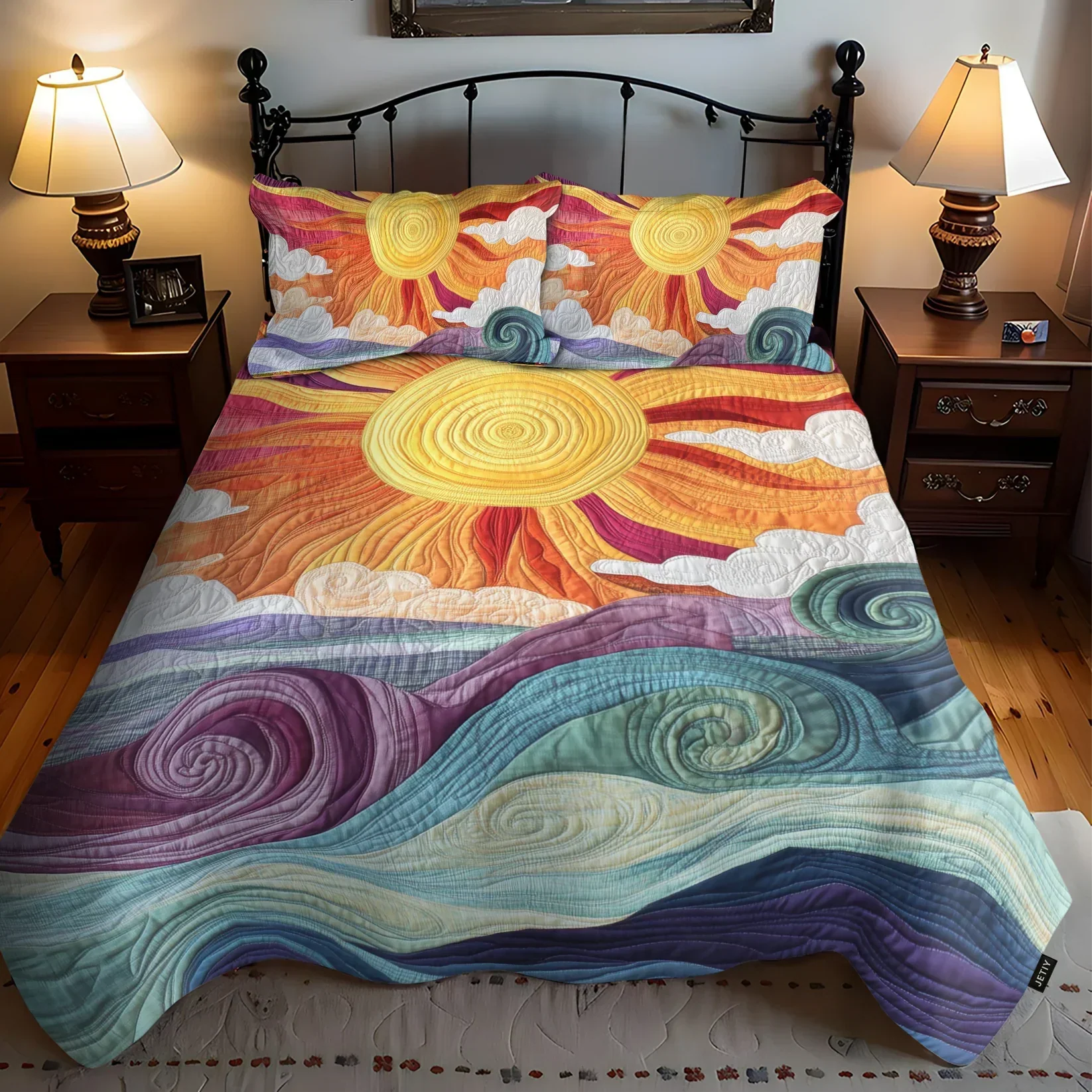 Quilted bedspread set with a bold golden sun with rays over ochre and terracotta in the Sunburst design
