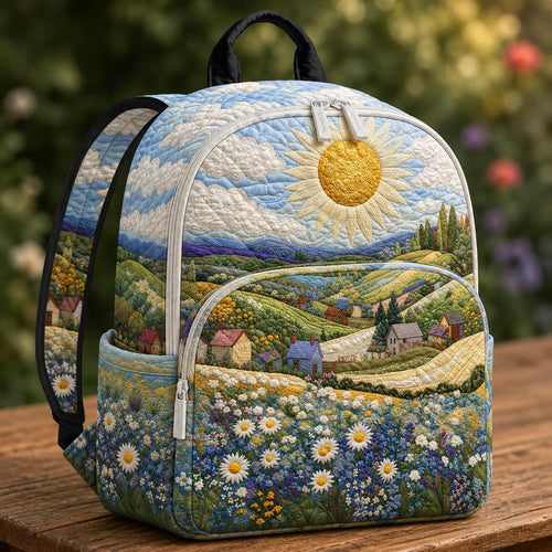 Artisan quilted backpack with a field of white daisies beneath a low sun across the quilted front