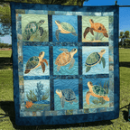 Turtle Squares in Blue quilted throw – sea turtles in nine blue squares