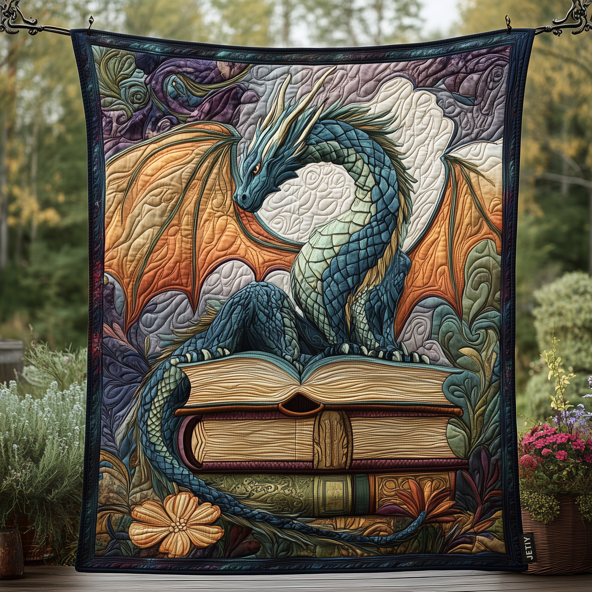 Dragon on Open Books quilted throw – teal dragon resting on open books