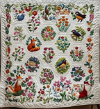 Woodland Hexagons quilted throw – foxes, birds and flowers in cream hexagons