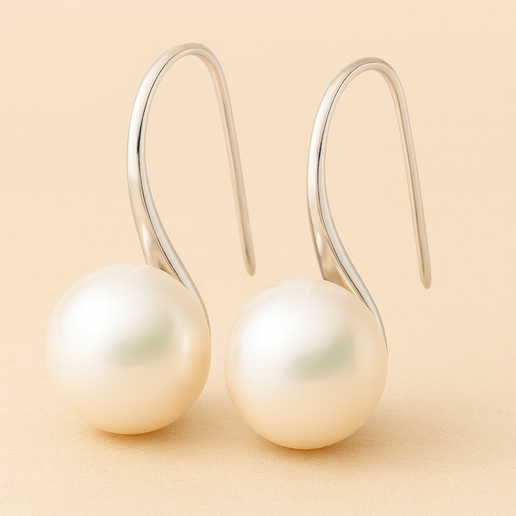 Classic pearl drop earrings on silver-tone hooks