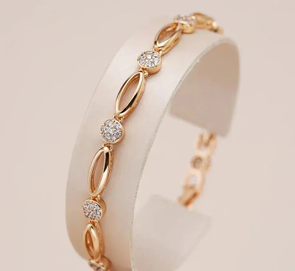 Gold-tone bracelet with oval links and crystal discs