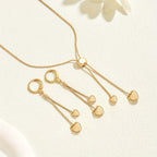 Gold-tone heart Y-necklace and heart drop earrings