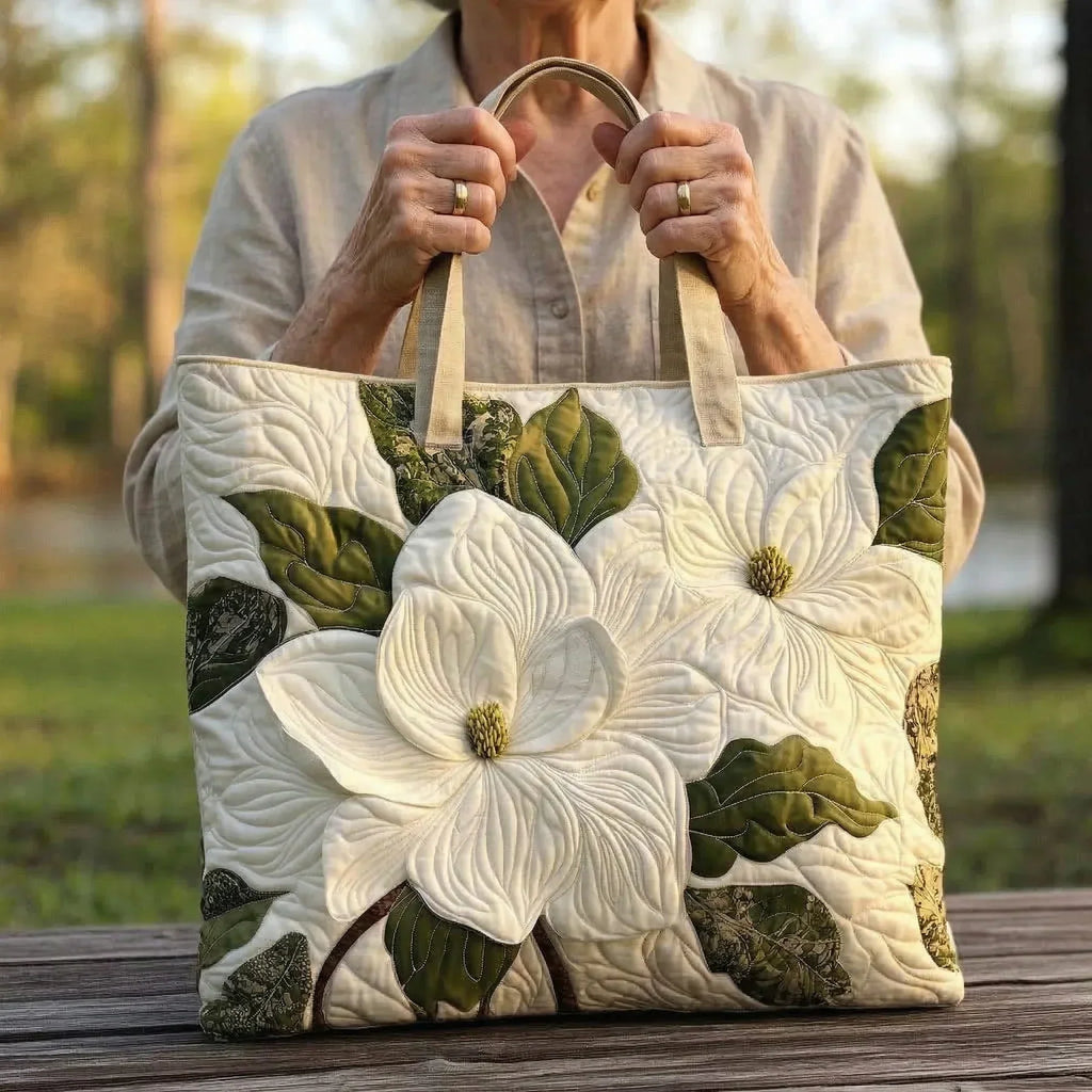 Woman carrying the Elegant Lilies artisan quilted tote bag