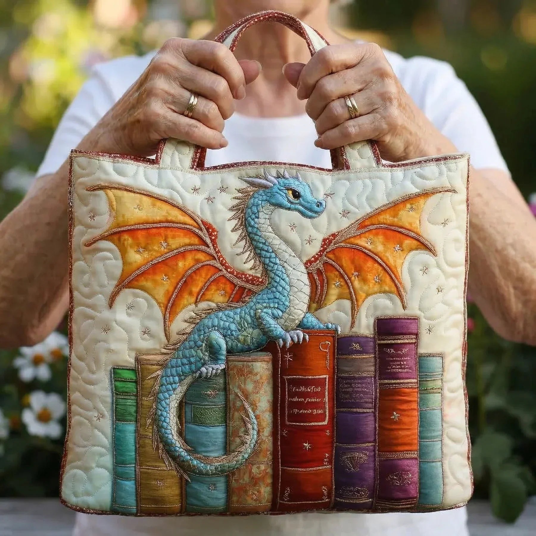Woman carrying the Emerald Book Dragon artisan quilted tote bag